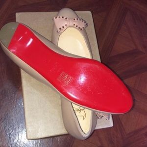 Rose gold Christian Louboutin flats.